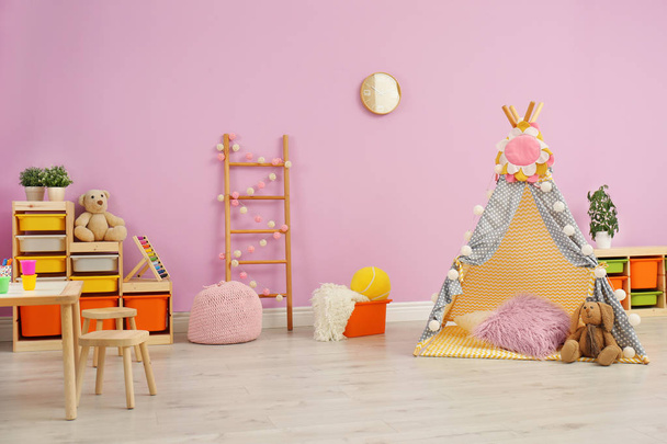 Modern nursery room interior with play tent for kids - Фото, изображение