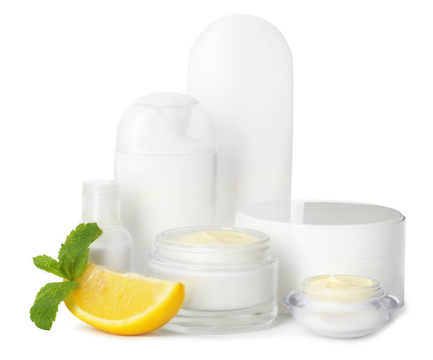 Jars with cream and bottles on white background. Hand care cosmetics - Φωτογραφία, εικόνα