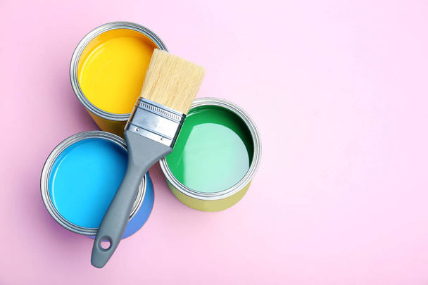 Flat lay composition with paint cans and brush on color background. Space for text - Fotoğraf, Görsel