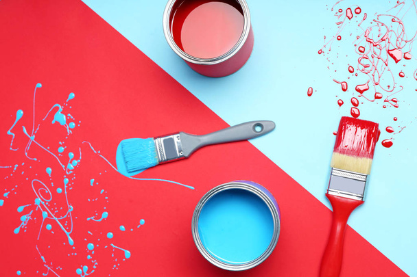 Flat lay composition with paint cans and brushes on color background - Photo, Image