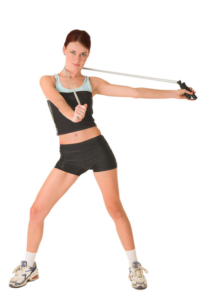 Woman looking serious in gym wear holding skipping rope. - Fotó, kép
