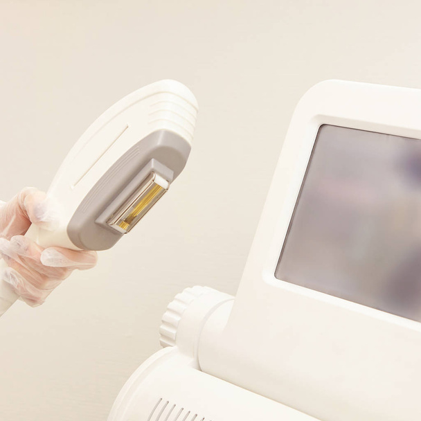 Hair laser removal service. IPL cosmetology device. Professional apparatus. Woman soft skin care. - Fotoğraf, Görsel