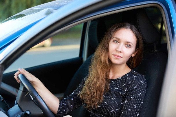 Car insurance driver. Pretty girl. Beauty lady inside. Drive school. - Photo, Image