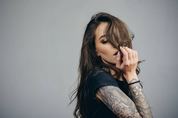 American latinos woman. Sexy brutal girl with tattoo. Stylish woman - casual clothing. Beautiful attractive Fashion woman. Care and hair products. - 写真・画像