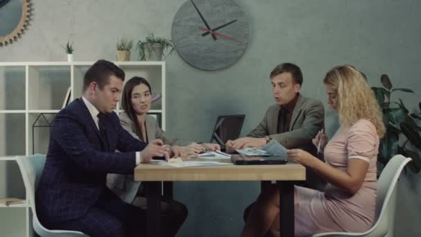 Team of managers discussing business strategies - Materiał filmowy, wideo