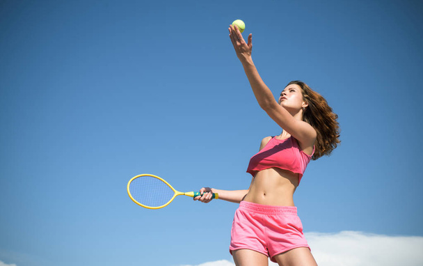 Girl with athletic body playing tennis. Happy active female workout. Beautiful attractive fitness woman. Sporty young woman. Tennis concept. - Φωτογραφία, εικόνα