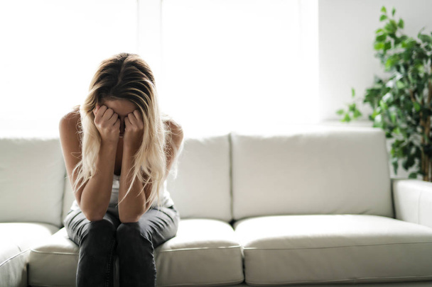 Unhappy lonely depressed woman at home living room - Foto, Imagen