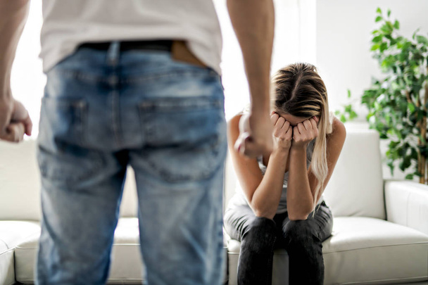 Man beating up his wife illustrating domestic violence - Foto, Imagem