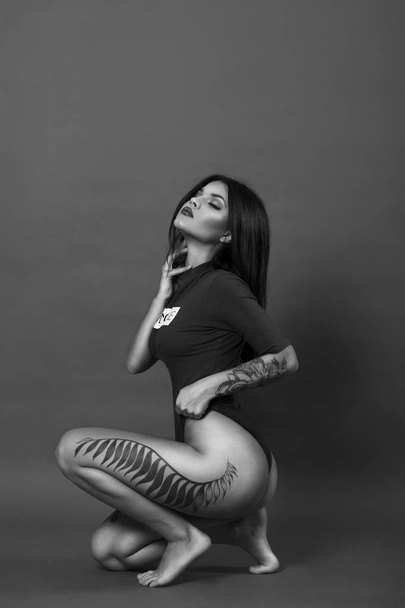 Sexy girl with tatoo - Photo, Image