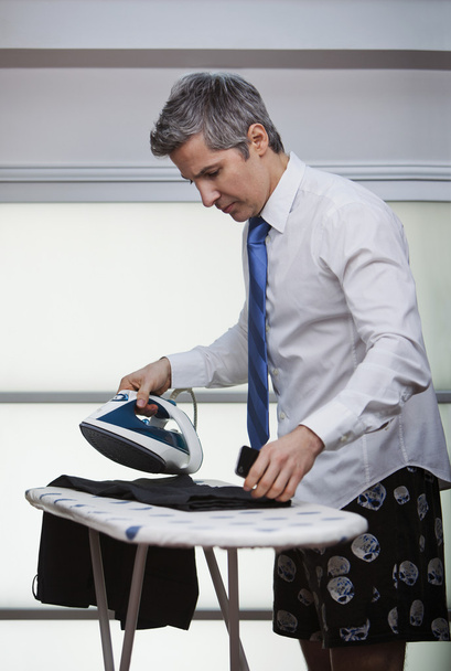 Businessman ironing pants - Photo, Image