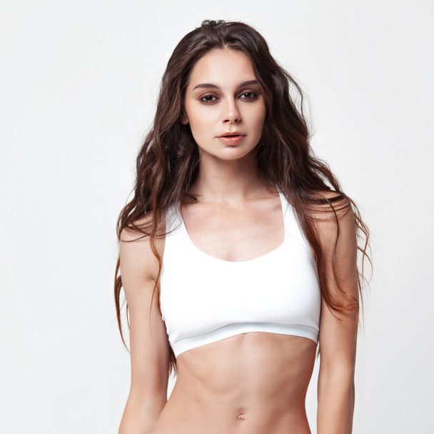 Sexy young woman in underwear on white background. Beauty portrait. Skin and body care - Φωτογραφία, εικόνα