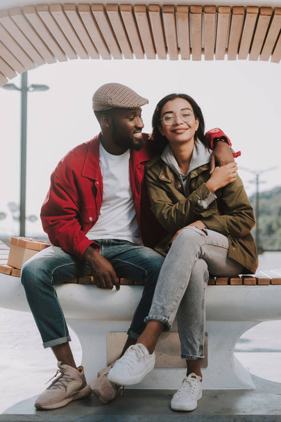 Positive young afro American man embracing his beautiful girlfriend - Fotoğraf, Görsel