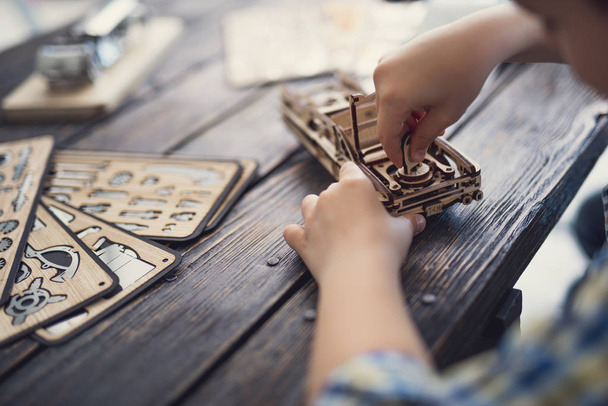 Close up of the child putting pieces of the constructor together - Fotoğraf, Görsel