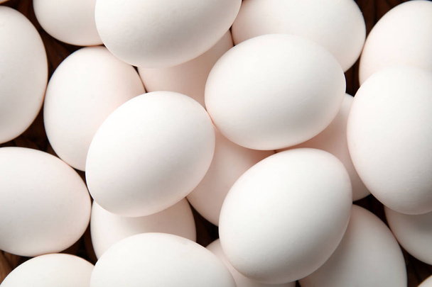 Pile of raw white chicken eggs, top view - 写真・画像