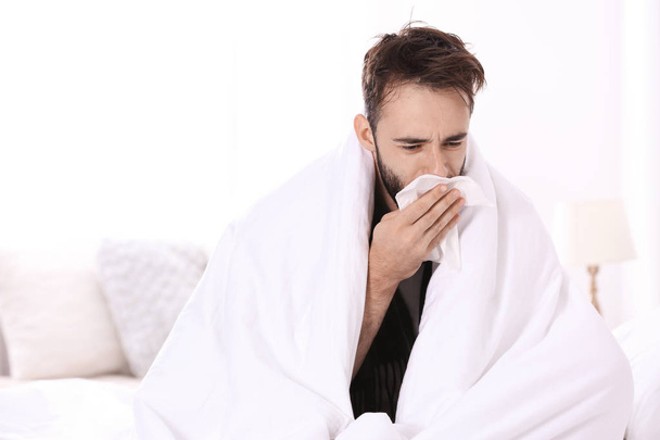 Ill man suffering from cough at home - Photo, Image