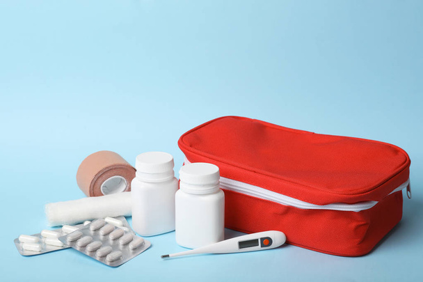 First aid kit on color background. Health care - Fotoğraf, Görsel