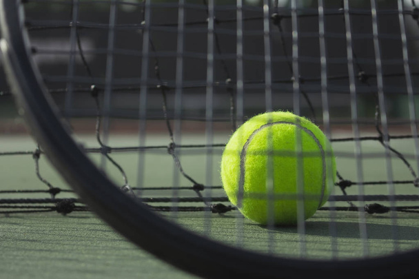 tennis ball and racket at tennis court, close up tennis ball in court - Photo, Image
