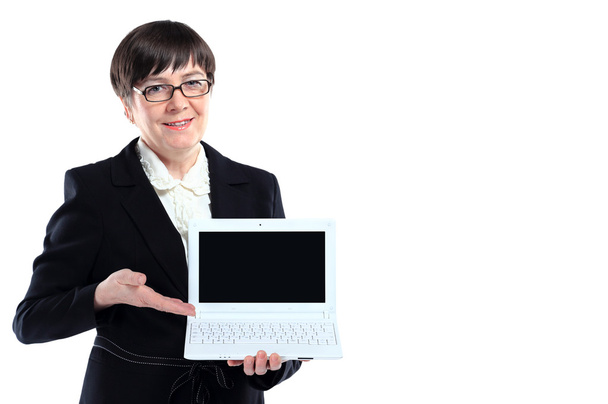Mature business woman with laptop against white background with copy space - Foto, Bild
