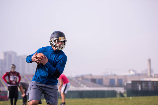 group of young american football players in action during the training at field - Фото, зображення