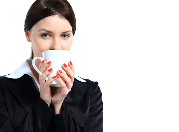 Nice business woman with a cup of coffee. Isolated on a white background. - Foto, immagini