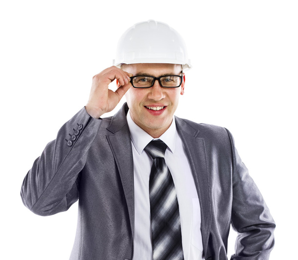 Happy young foreman on building site with hard hat white background - Photo, Image