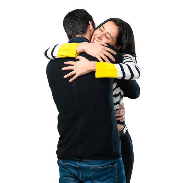 Young couple hugging on white background - Fotografie, Obrázek
