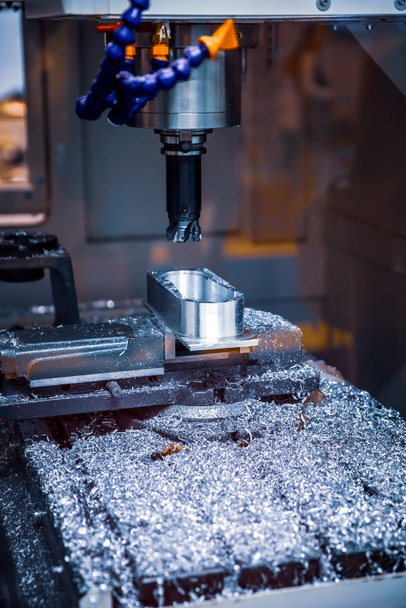 Metalworking CNC milling machine. Cutting metal modern processing technology. Small depth of field. Warning - authentic shooting in challenging conditions. A little bit grain and maybe blurred. - Photo, Image