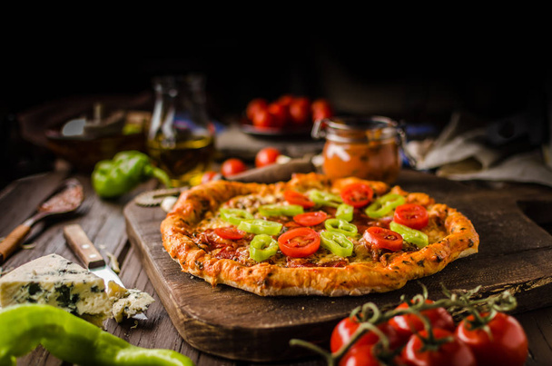 Rustic old style vintage pizza, wood board, fresh food - Photo, Image