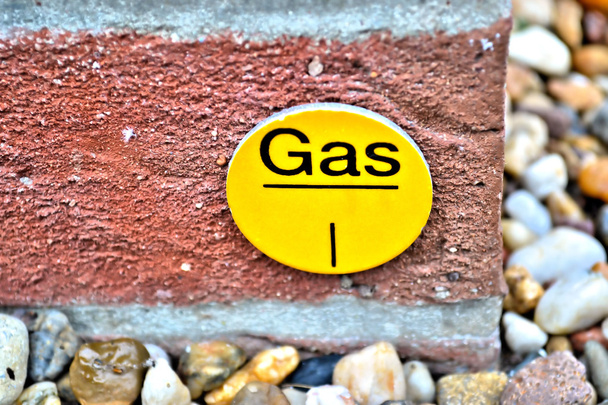 um sinal para um tubo de gás
 - Foto, Imagem