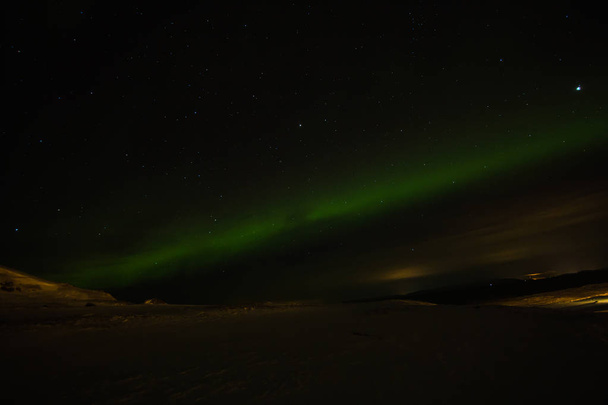 amazing aurora borealis activity or northern lights above ekkeroy island in norway - Photo, Image