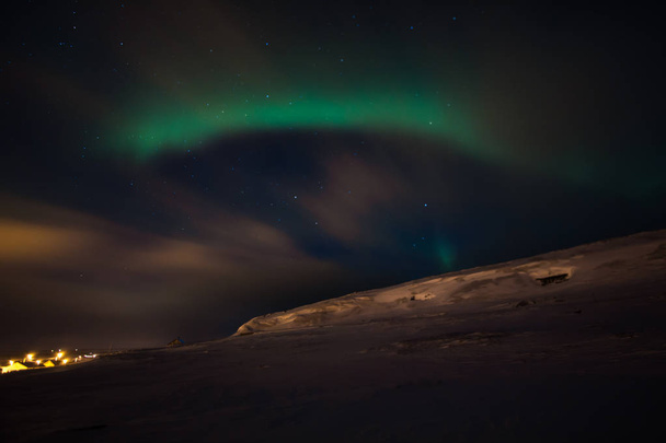 amazing aurora borealis activity or northern lights above ekkeroy island in norway - Photo, Image
