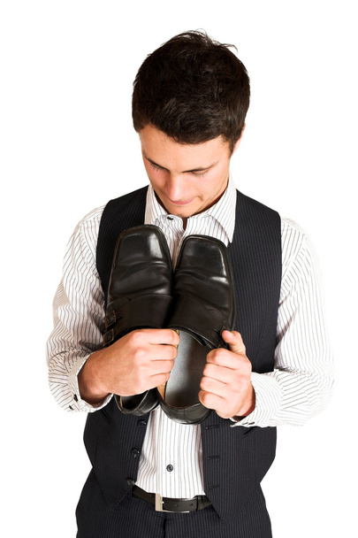 Businessman holding his shoes - Фото, зображення