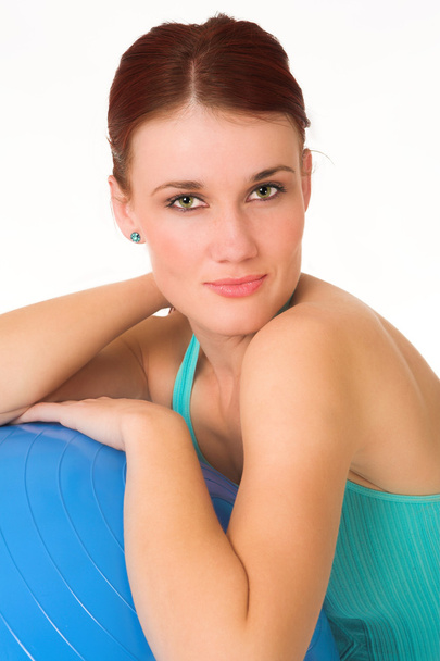 Woman resting with blue gym ball. - 写真・画像