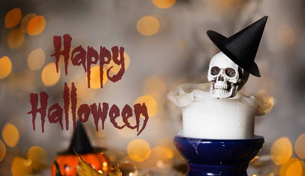 Skull on an used old candle. Spooky halloween background - Φωτογραφία, εικόνα