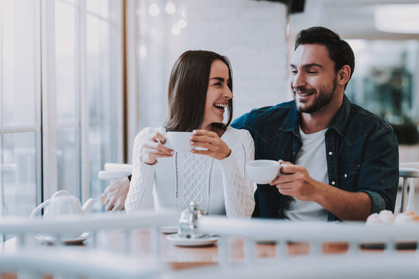 Love Story. Tea Party.Guy and Girl. Have Fun. Enjoyment. Tea. Cheerful Girl.Teapot. Bonding. Cupcake. Leisure Time.Together in Cafe. Happy Together. Smiling People. Good Relationship. Happy Holidays. - Photo, image