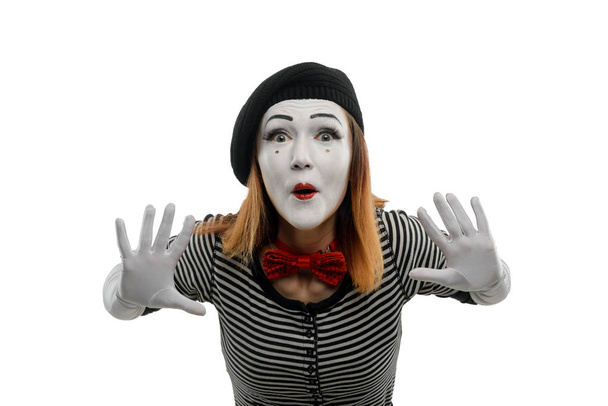 Female mime pushing invisible object - Foto, Imagen