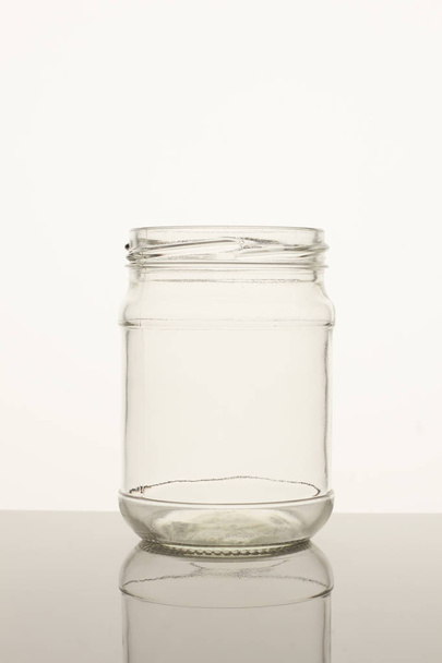 Empty transparent glass pot. - Фото, изображение
