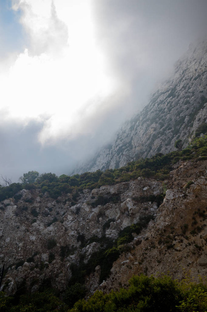 Clouds form on the East side of the Rock of Gibraltar. Gibraltar is a British Overseas Territory located on the southern tip of Spain. - Foto, Imagen