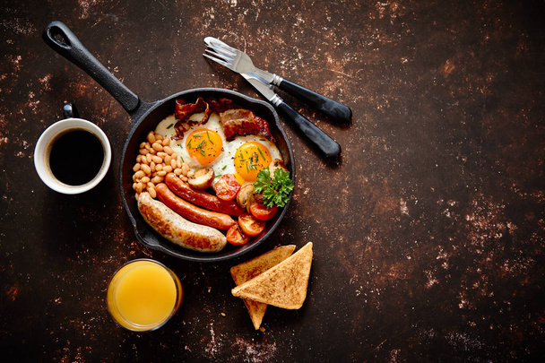 Delicious english breakfast in iron cooking pan - Photo, Image