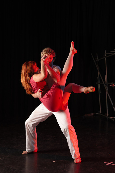 Caucasian male dancer lifting his female partner - Fotó, kép