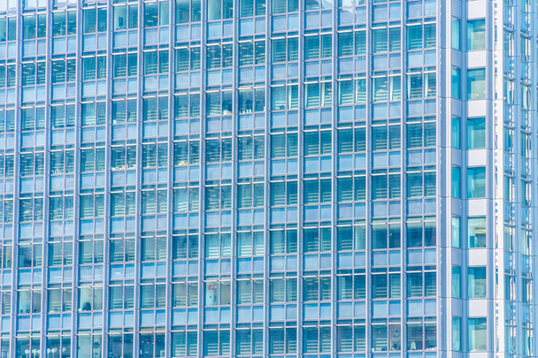 Beautiful architecture business office building with window glass pattern in the skyscraper city - Foto, imagen