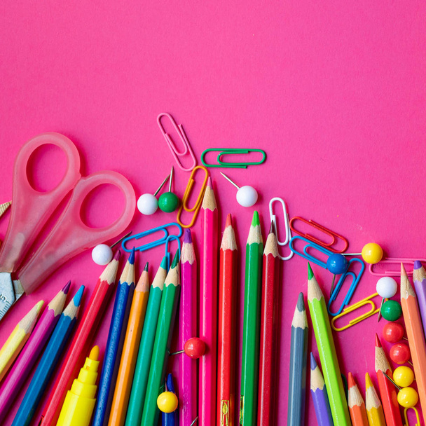 Different school supplies on pink background - Foto, immagini