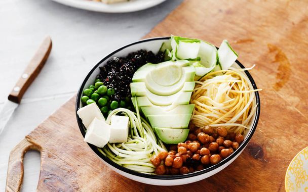 buddha bowl with Avocado, peas, black quinoa, cucumber, zucchini and chickpea  - Photo, Image
