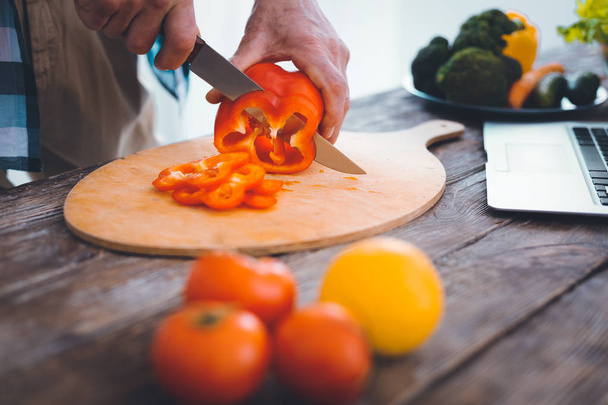 Close up of red pepper being cut - Photo, Image
