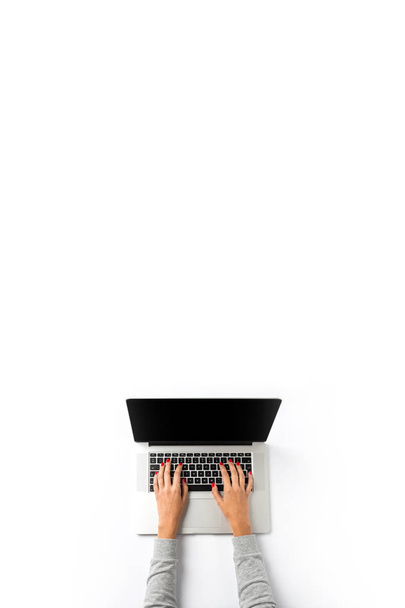 Overhead shot of woman working on laptop - Фото, изображение