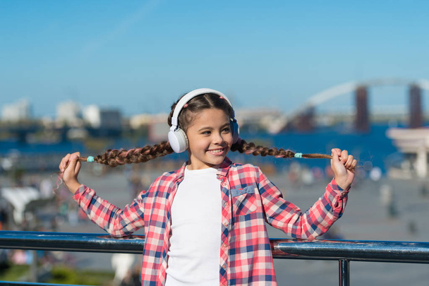Happiness is for now. Little girl listen to music outdoor. Happy child wear headphones. Little music fan. Happy little girl. So start the music - Fotoğraf, Görsel