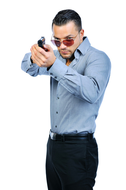 Красивый мужчина с пистолетом элегантный шпион
 - Фото, изображение