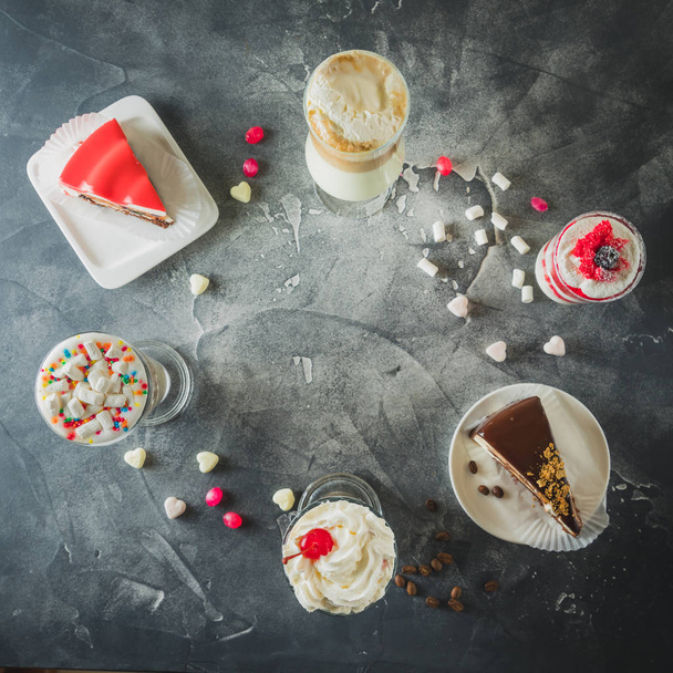 Food frame with milkshake drinks and desserts. Milkshakes and cake - Fotó, kép