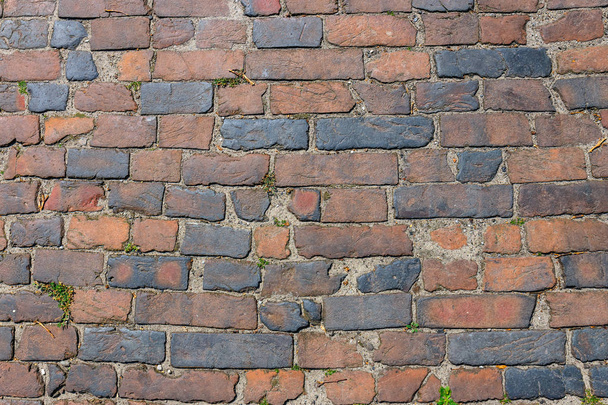 Dark brown old bricks wall, can use as background - Foto, afbeelding