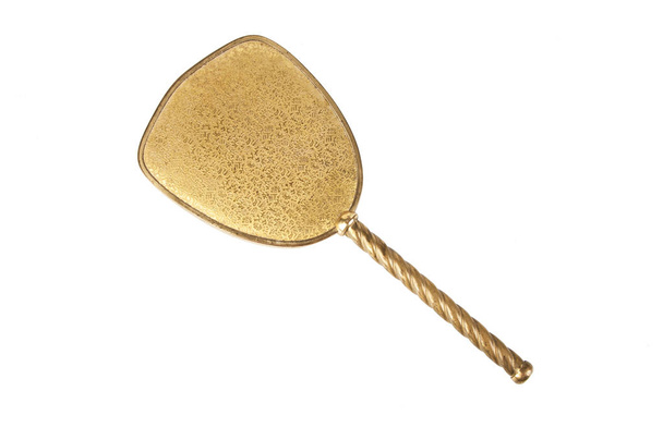 Vintage brass hand mirror isolated on white background. Copy space for text. - Photo, Image